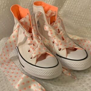Converse women’s White All Star high tops with peach inner lining, size 8.